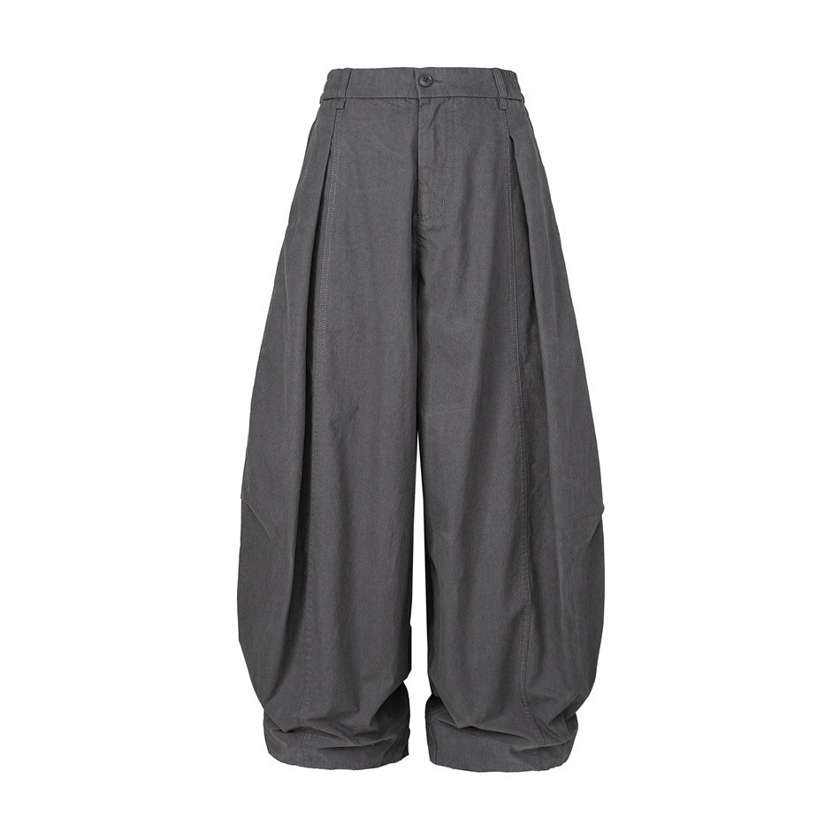 Dark gray wide-leg balloon pants with elastic waistband, front pleats and cuffed hems, flat front view