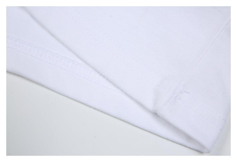 Close-up of a white garment seam and stitched hem.