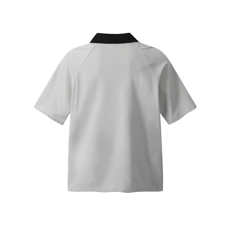 Back view of a light gray short-sleeve polo shirt with a black collar and raglan seams.