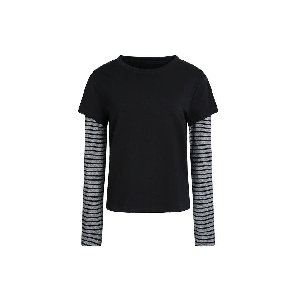 Black layered faux two-piece top with black short-sleeve body and gray and black striped long sleeves, flat front view
