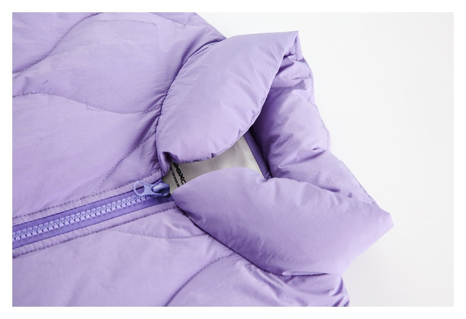 Close-up of a lavender padded jacket's collar, zipper, and folded fabric details.