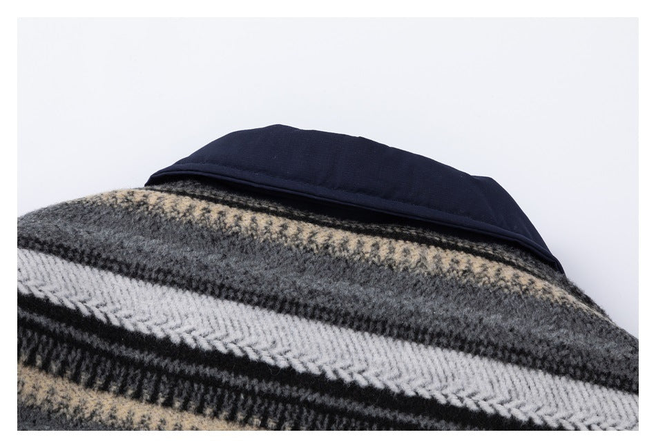 Close-up of the navy collar above a black, gray, cream, and white plaid garment.