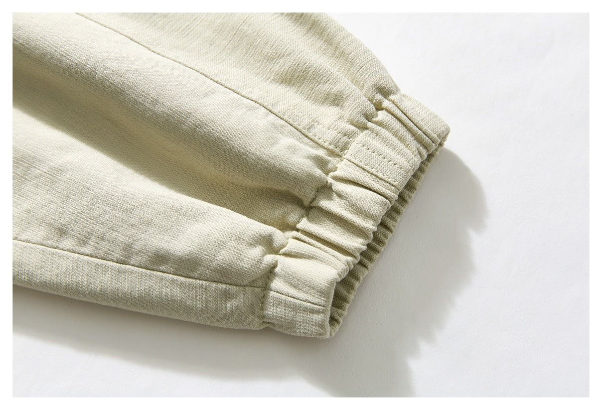 Close-up of the pale beige jacket sleeve ending in a gathered elastic cuff.