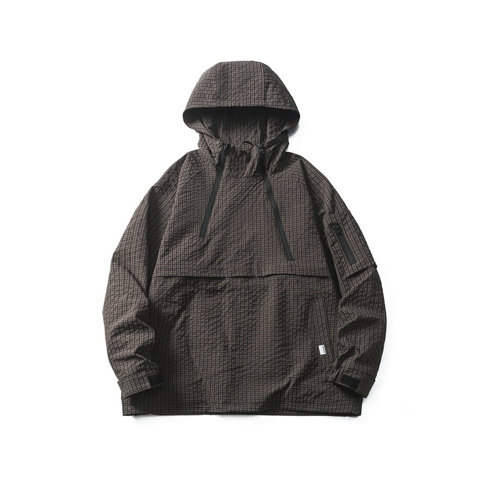 Dark gray-brown checked hooded half-zip jacket flat lay with diagonal zippers, sleeve zip pocket and cuff tabs