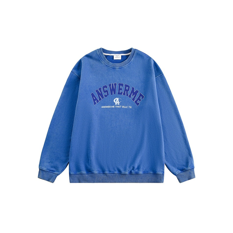 Blue washed crewneck sweatshirt flat lay with arched navy ANSWERME chest graphic and ribbed trim