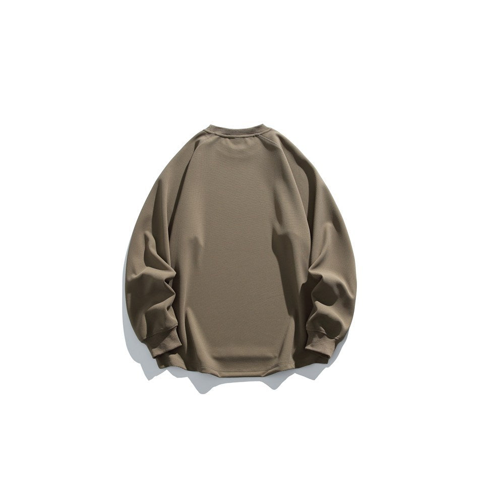 Brown waffle-knit crew neck sweatshirt, flat lay back view with raglan sleeves and ribbed cuffs
