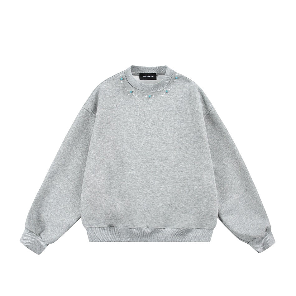 Heather gray crewneck sweatshirt, front flat lay, with white and turquoise-colored beads around the neckline