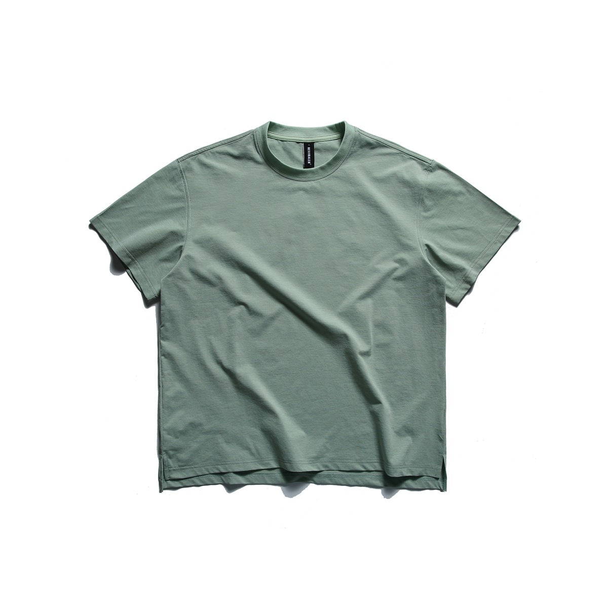 Light green short-sleeve crew neck T-shirt laid flat, front view, with side hem slits