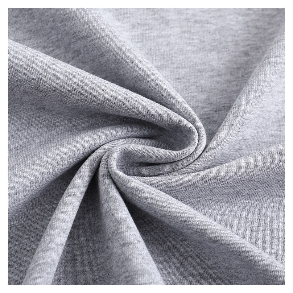 Close-up of heather gray knit fabric gathered into soft folds.