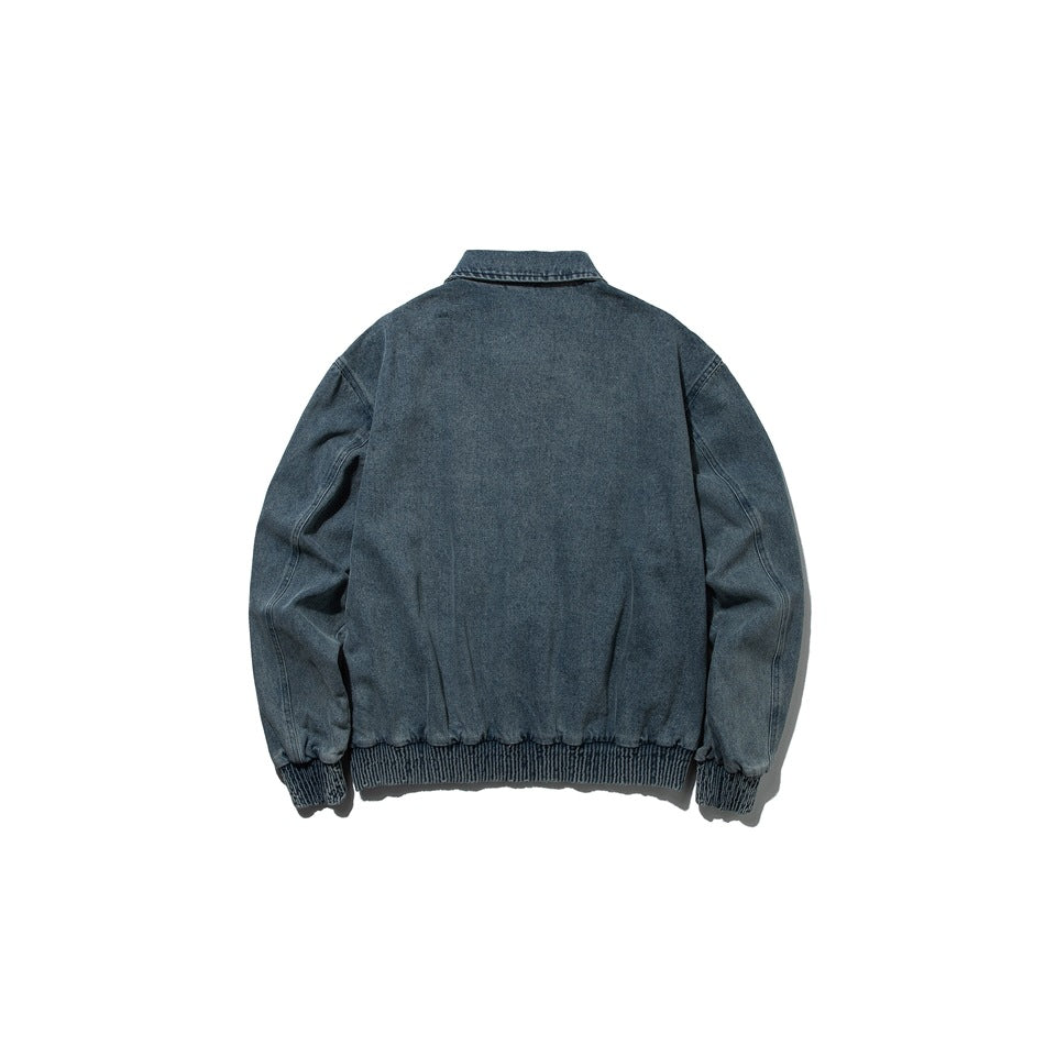 Back view of washed blue denim jacket showing plain back panel, collar, ribbed hem and ribbed cuffs