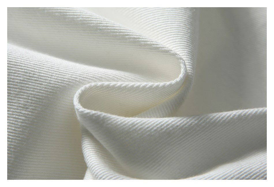 Close-up showing the fine ribbed texture and drape of white fabric.
