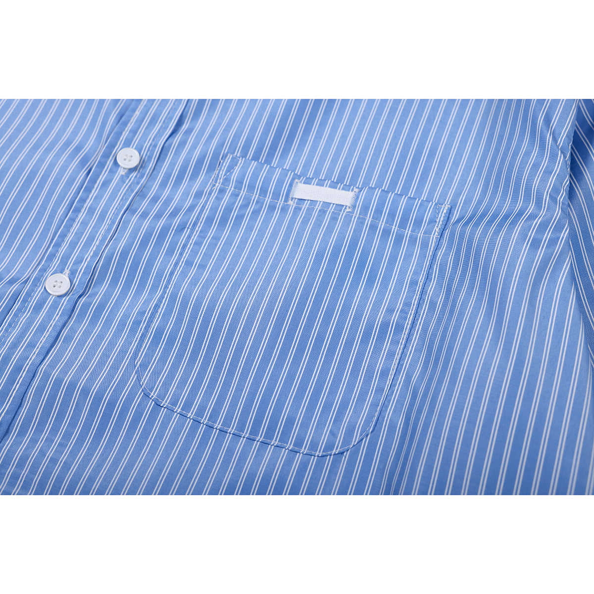 Close-up of a blue-and-white striped shirt pocket and button placket.
