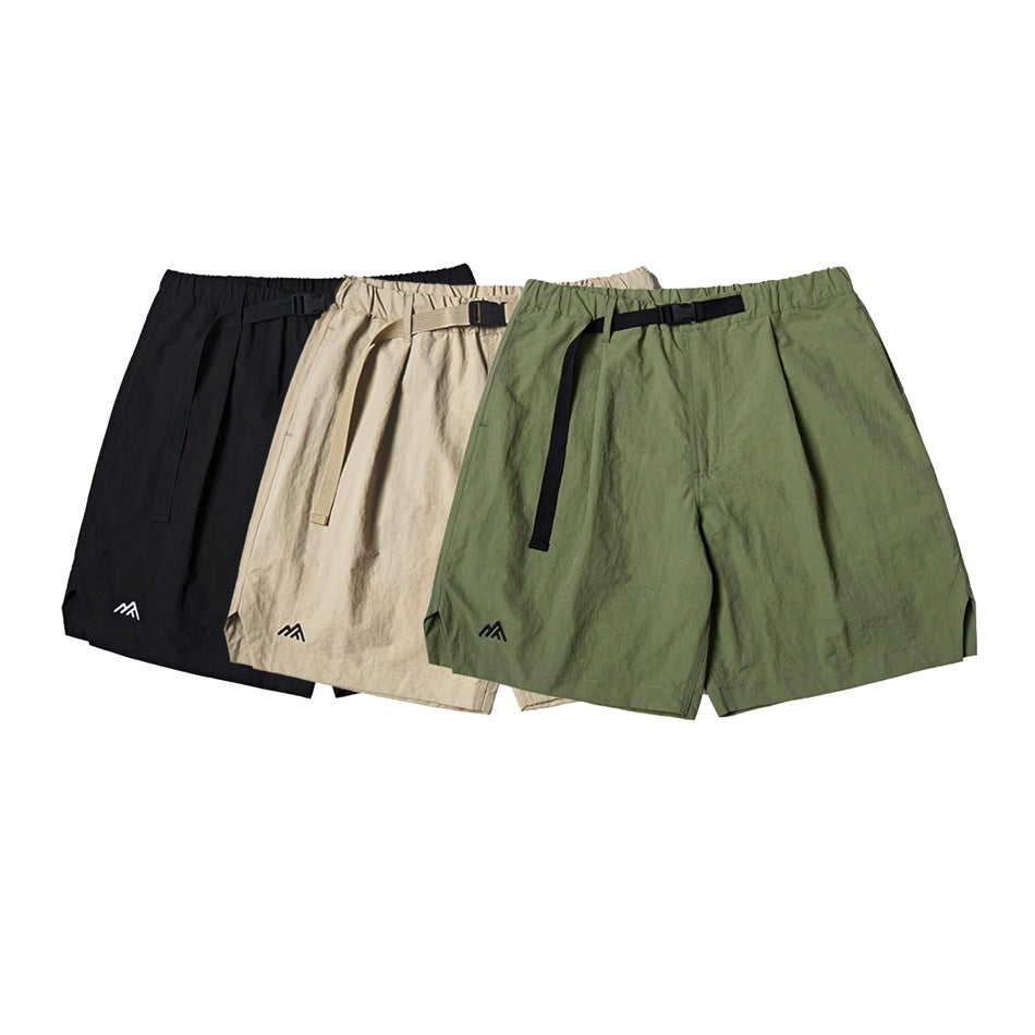 Front view of black, beige and olive shorts with elastic waistbands and adjustable belts.