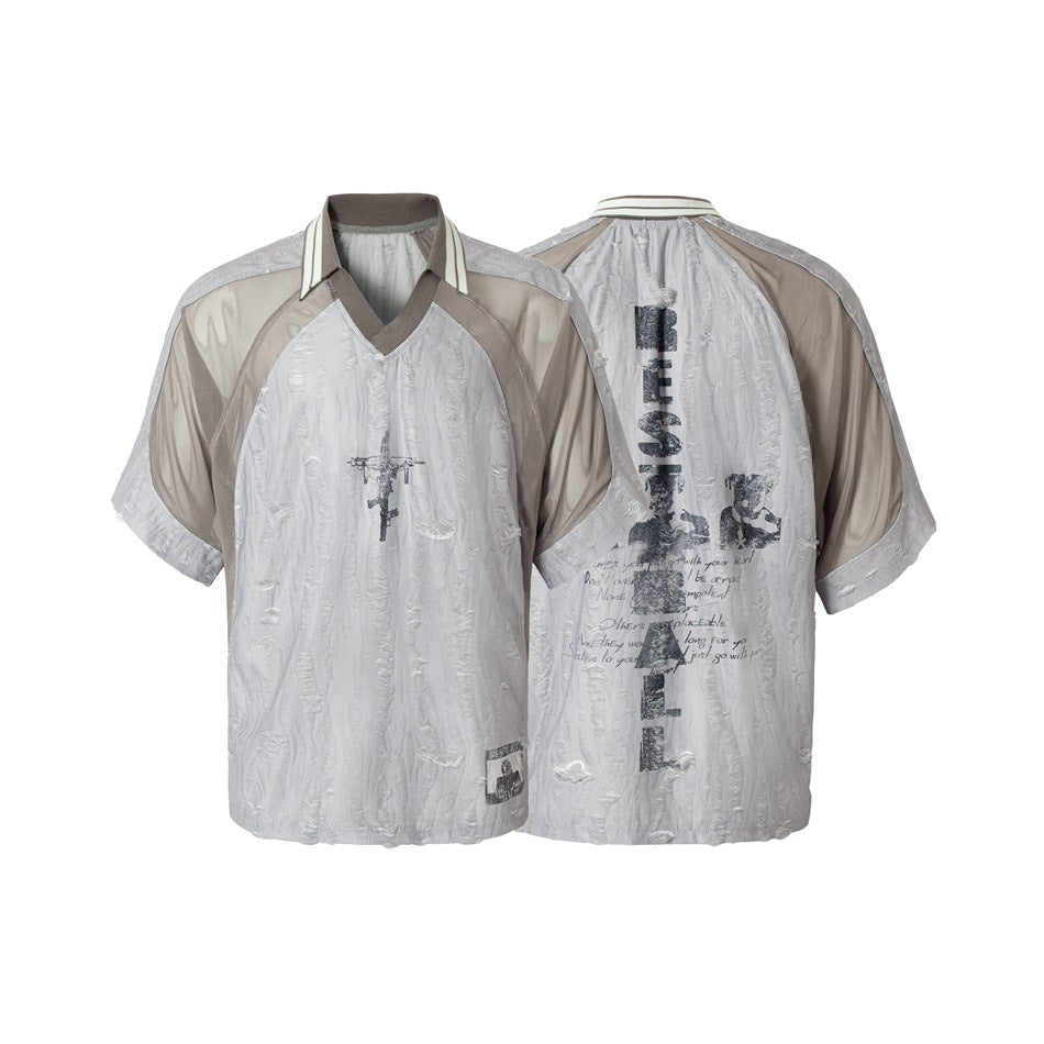 Pale gray short-sleeve V-neck top shown from front and back, with sheer taupe panels and dark printed graphics.