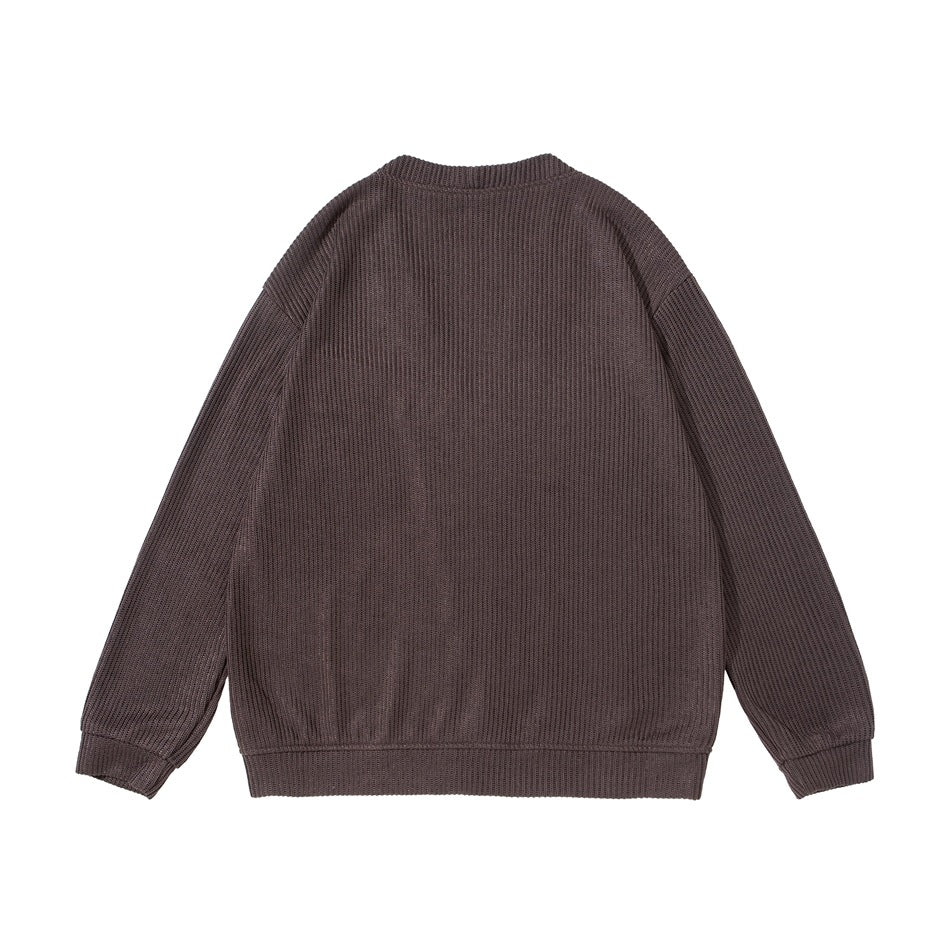 Back view of a dark brown ribbed cardigan with long sleeves and ribbed cuffs and hem.