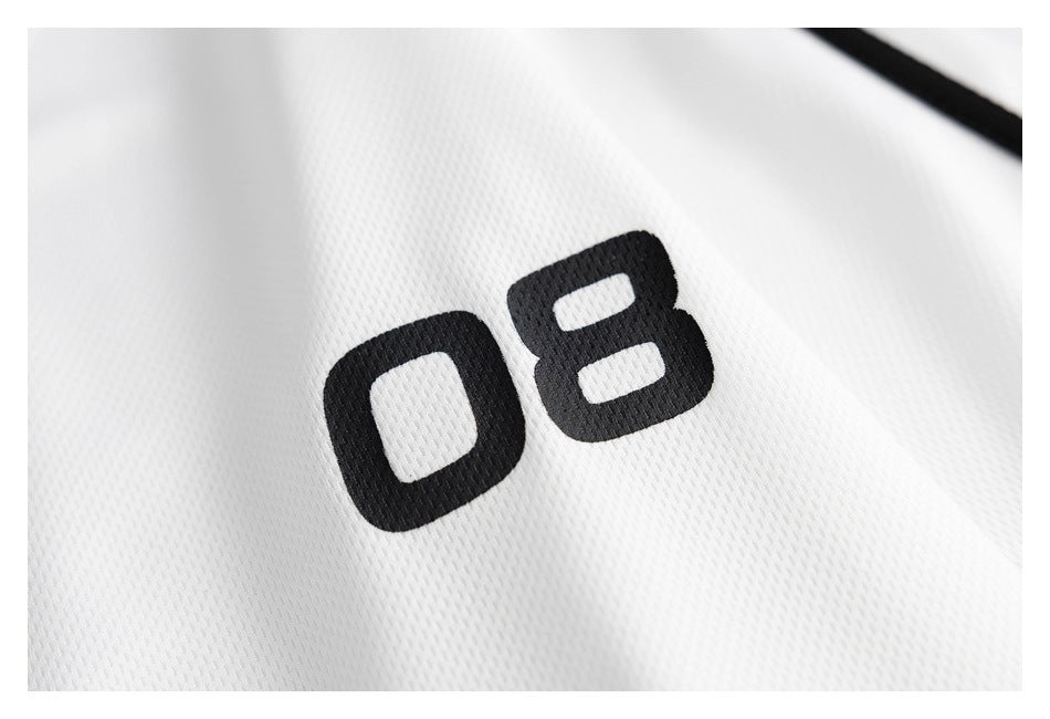 Close-up of a black number 08 printed on white textured jersey fabric.
