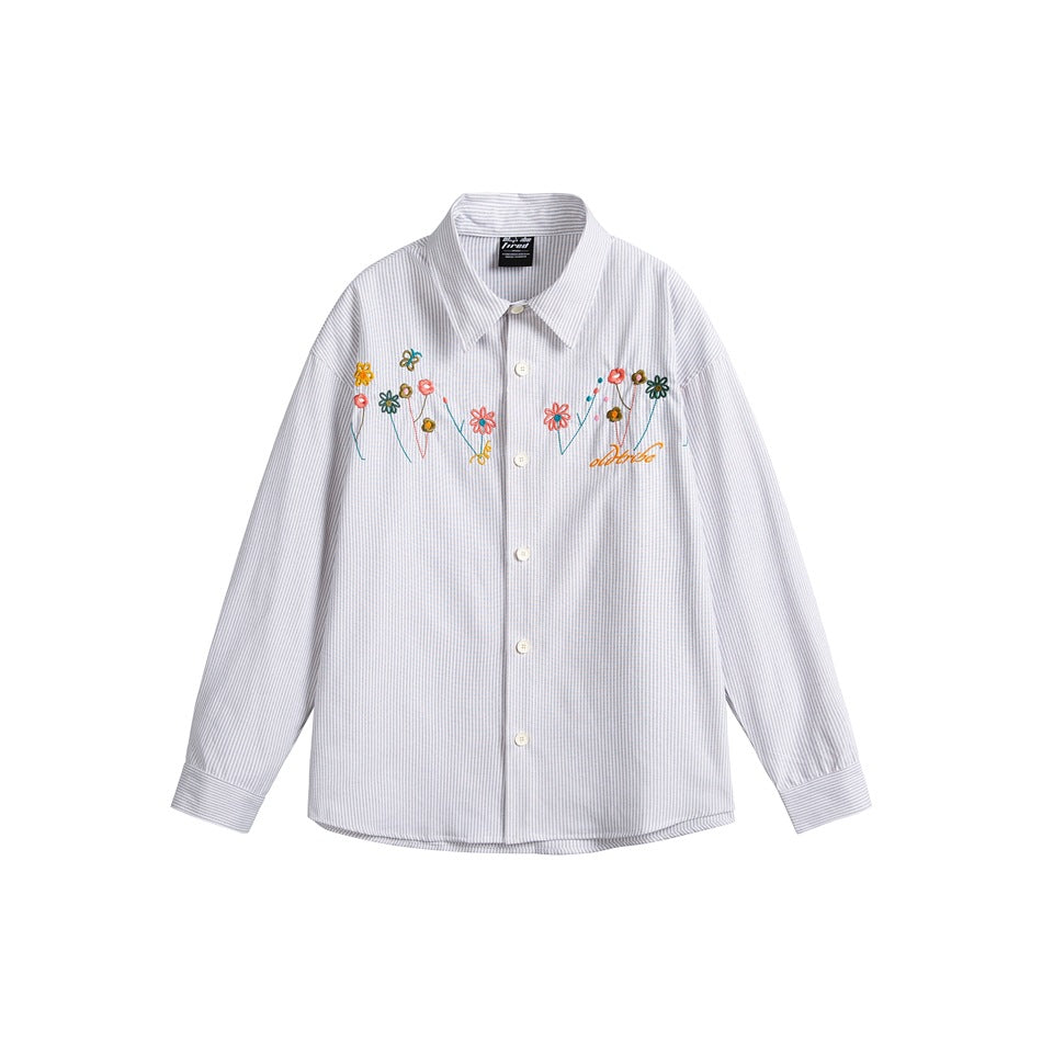 Light gray striped button-up shirt with colorful embroidered flowers across the chest, flat lay front view