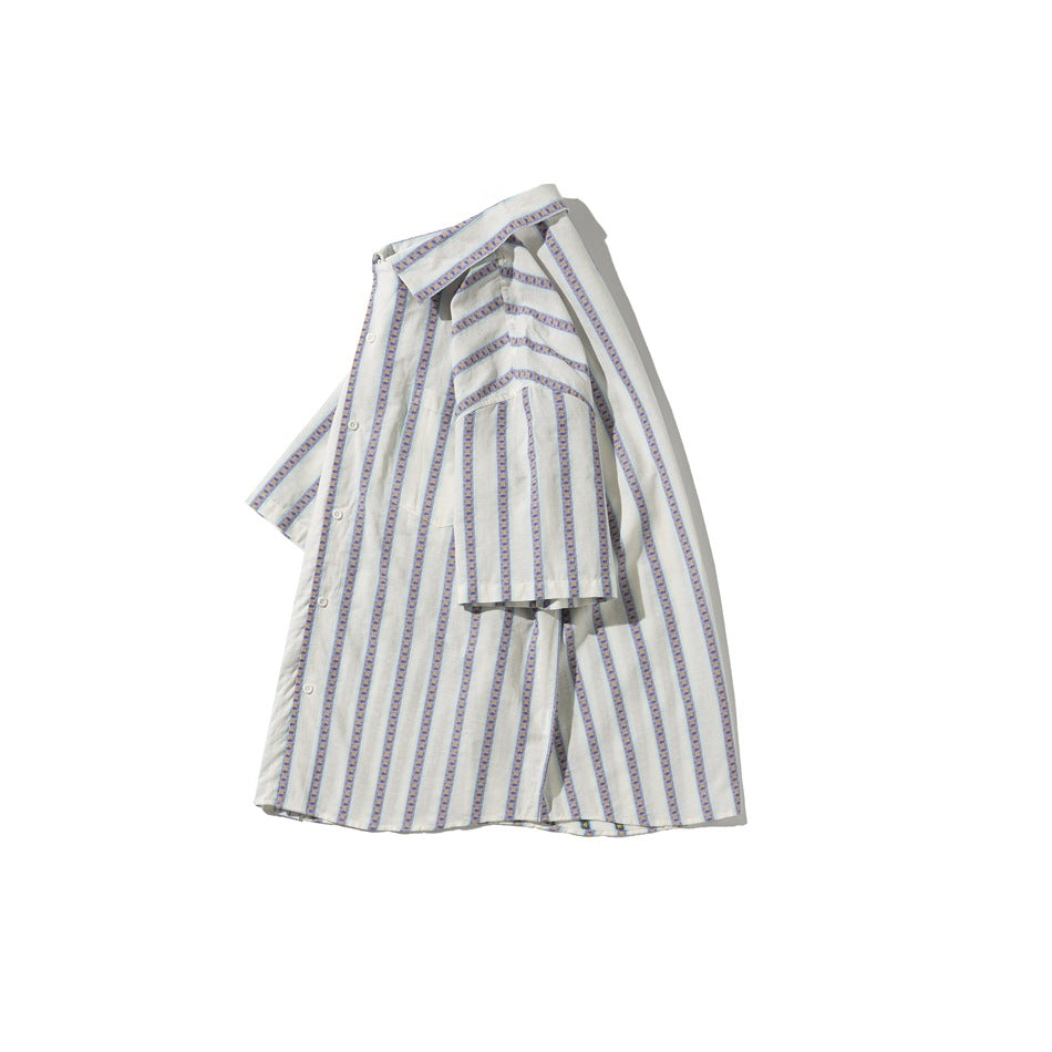 Ivory short-sleeve button-up shirt shown at an angle, with purple floral stripes, turquoise edging, and a chest pocket.