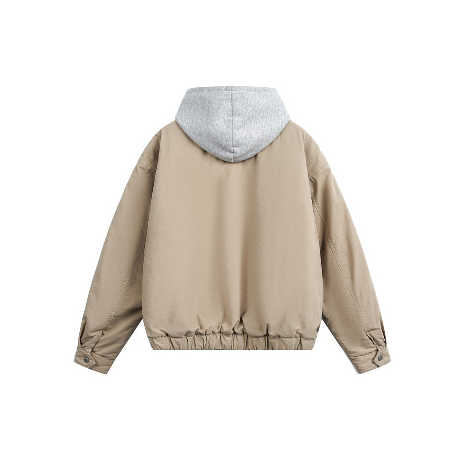Back view of a taupe jacket with a gray hood and gathered hem.