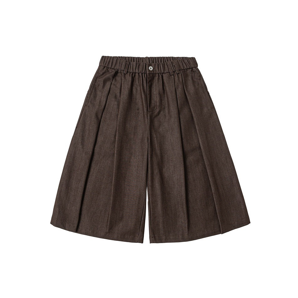 Brown wide-leg knee-length shorts with elastic waistband, button and front pleats, flat lay front view