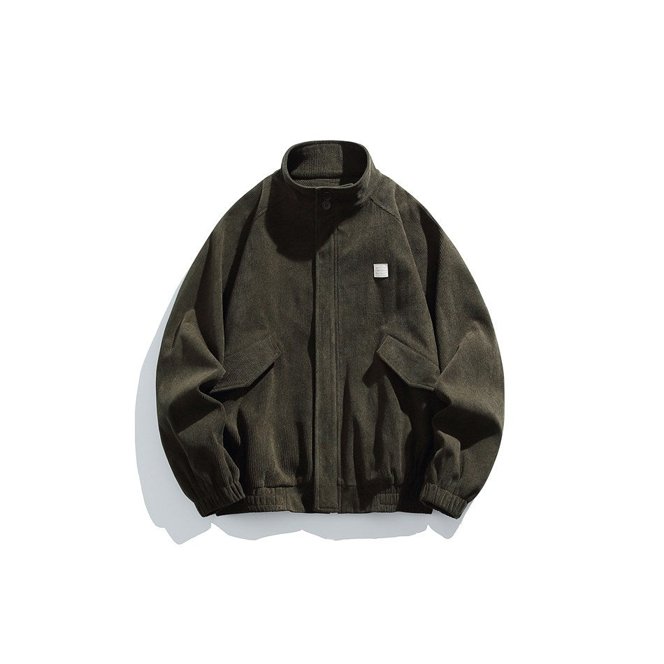 Dark green ribbed stand-collar jacket with front placket, flap pockets, chest patch and elastic hem, flat lay
