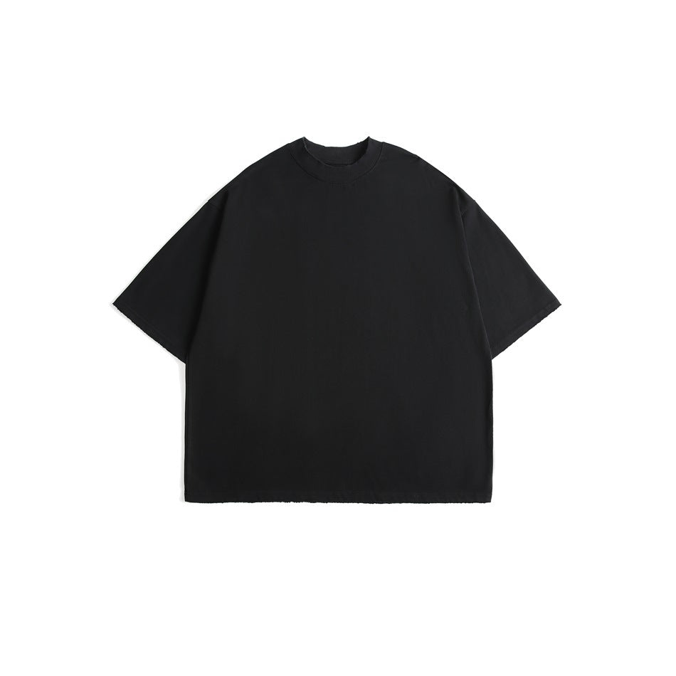 Black short-sleeve oversized T-shirt with a high ribbed crew neck and raw-edge hems, laid flat, front view