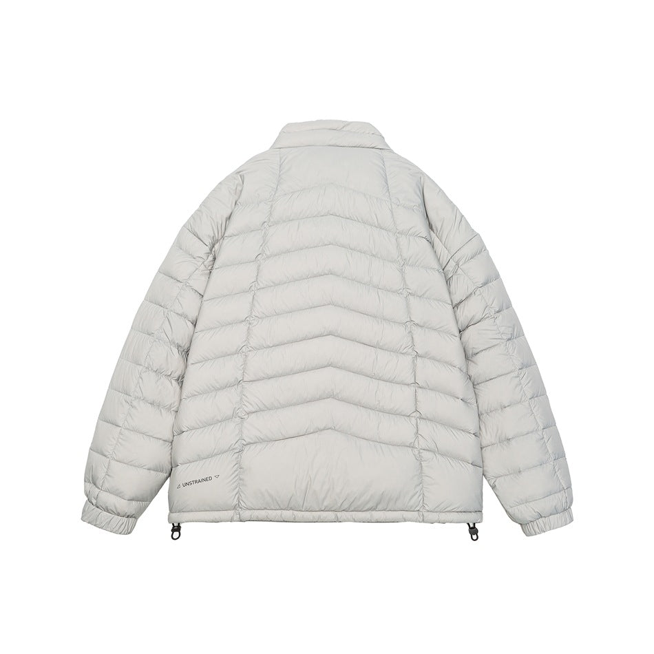 Back view of a light gray quilted jacket with chevron stitching, elastic cuffs, and adjustable hem toggles.
