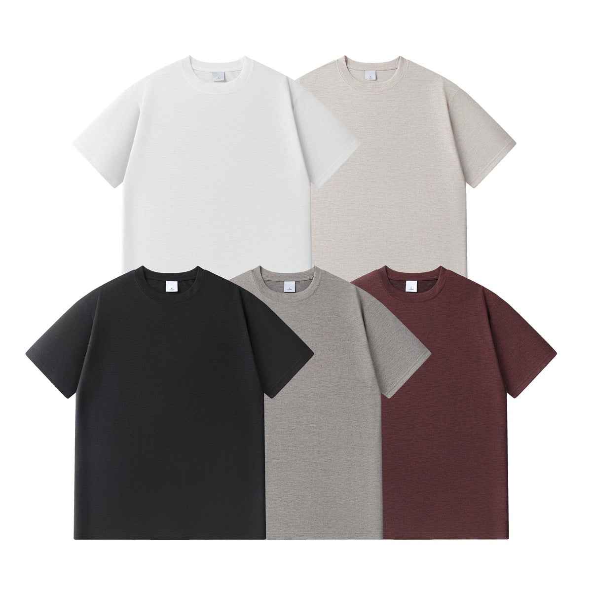 Five plain short-sleeve crew-neck T-shirts arranged together in white, beige, black, gray, and burgundy.