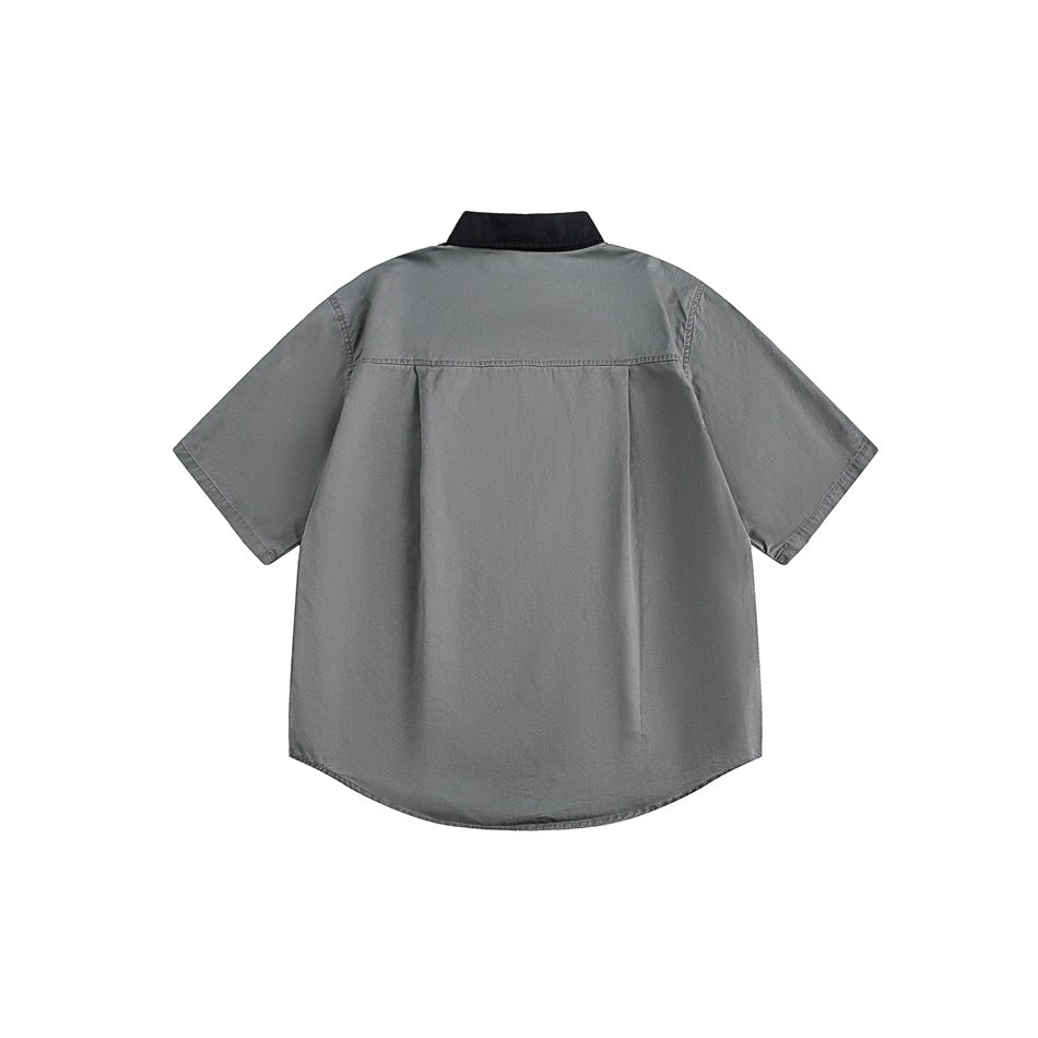 Back view of a charcoal-gray short-sleeve shirt with a black collar and curved hem.
