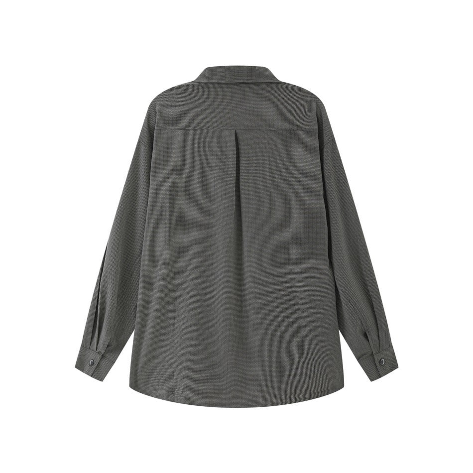 Back view of a charcoal gray long-sleeve shirt with a yoke seam and center pleat.