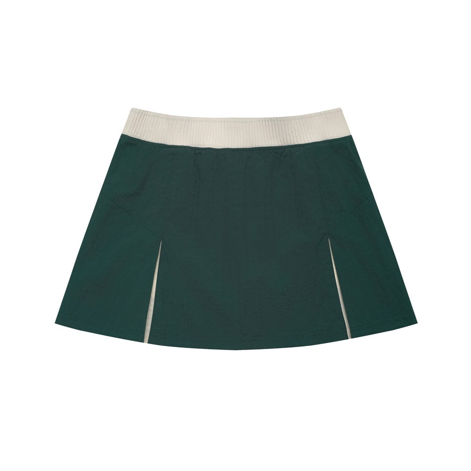 Dark green mini A-line skirt with beige ribbed waistband and two front slits with cream inserts