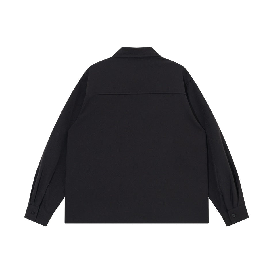 Black long-sleeve shirt back view with back yoke seam and buttoned cuffs, flat lay
