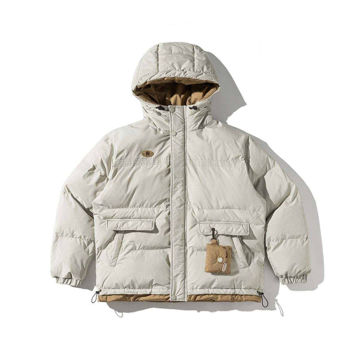 Beige hooded puffer jacket flat lay with tan lining, flap pockets, hanging pouch, elastic cuffs and drawcord hem
