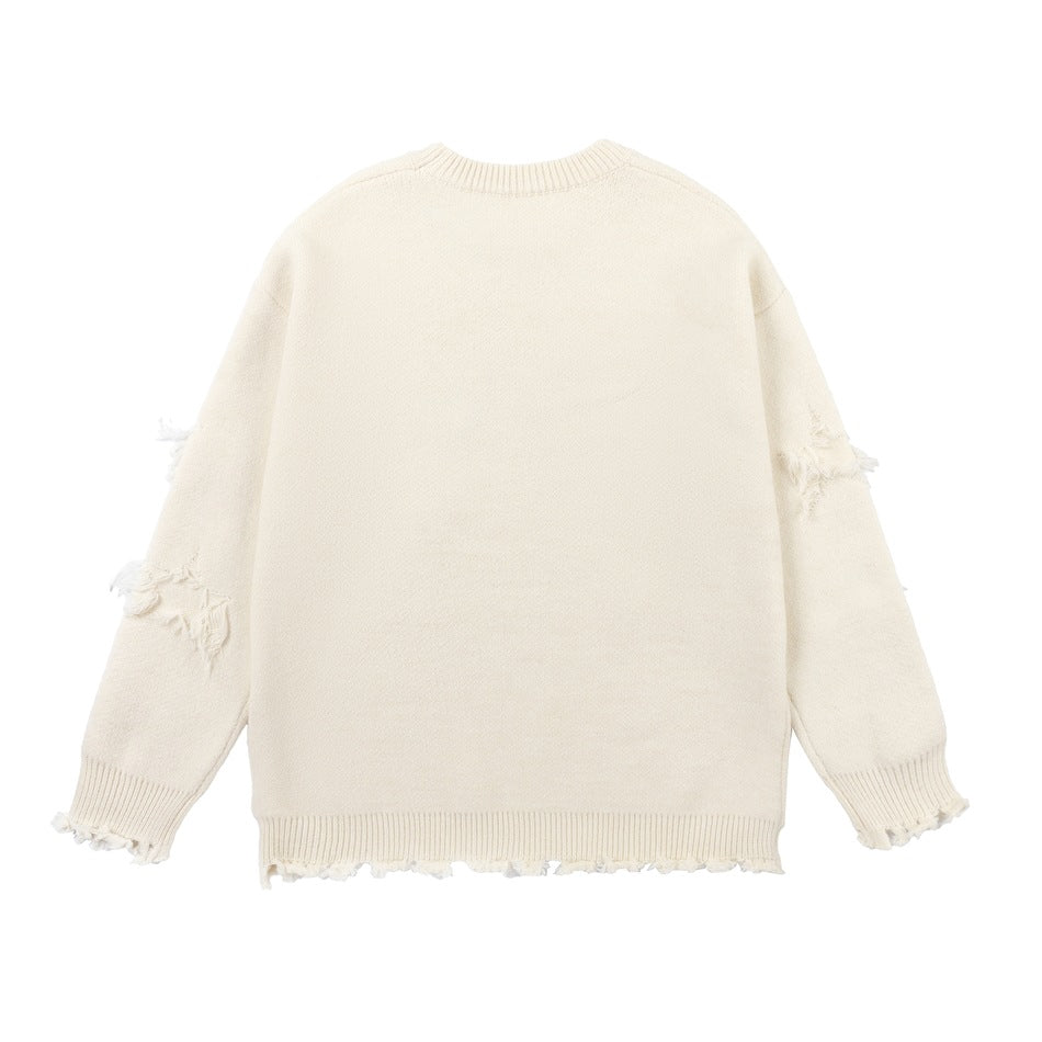 Back view of an ivory crewneck sweater with distressed patches on the sleeves and frayed ribbed cuffs and hem.