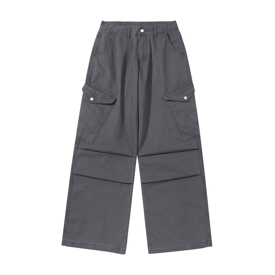 Dark gray wide-leg cargo pants with snap-flap side pockets and knee pleats, front flat lay