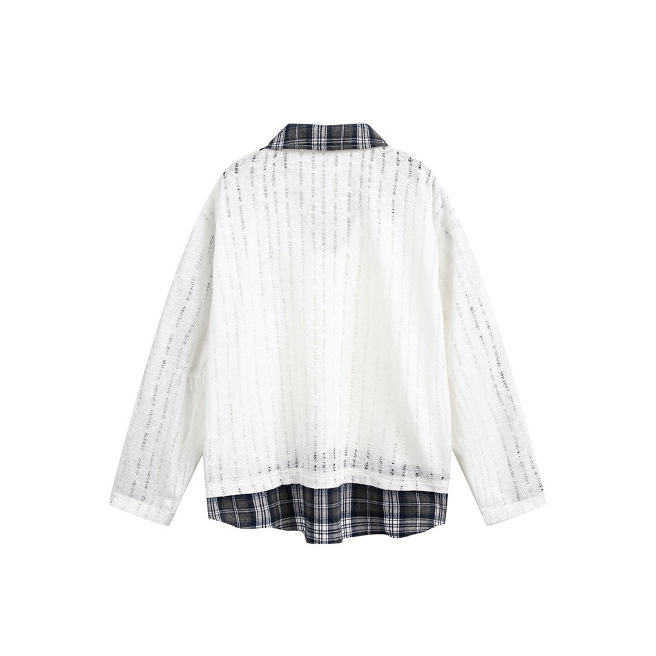 Back view of a white textured long-sleeve top with fine vertical stripes and navy plaid collar and hem accents.