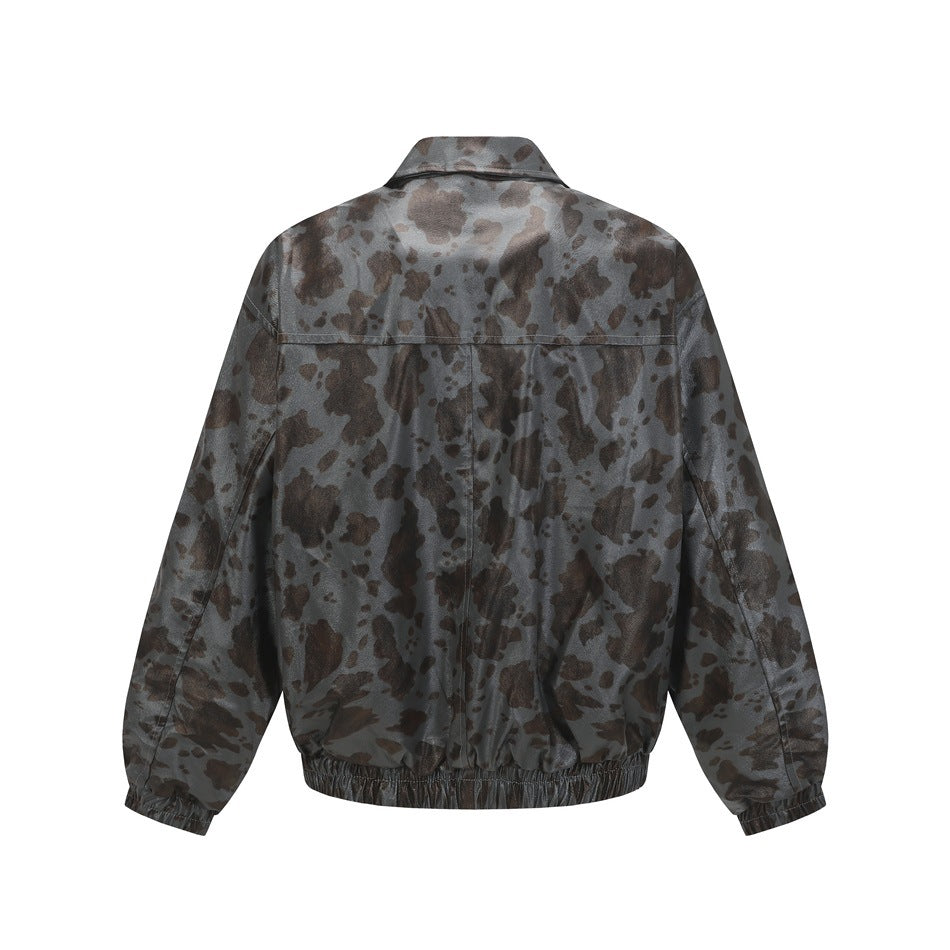 Back view of a gray jacket patterned with dark brown irregular spots, with a pointed collar and elastic hem.
