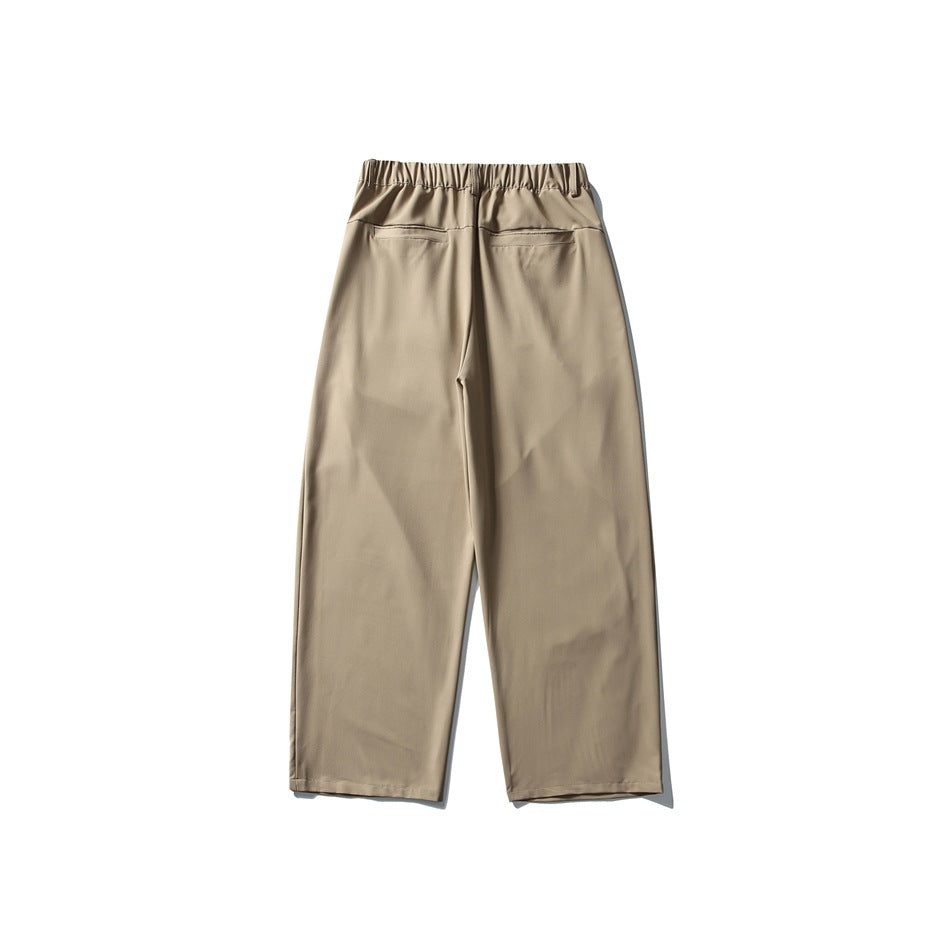 Back view of khaki wide-leg trousers with elastic waistband and two welt back pockets
