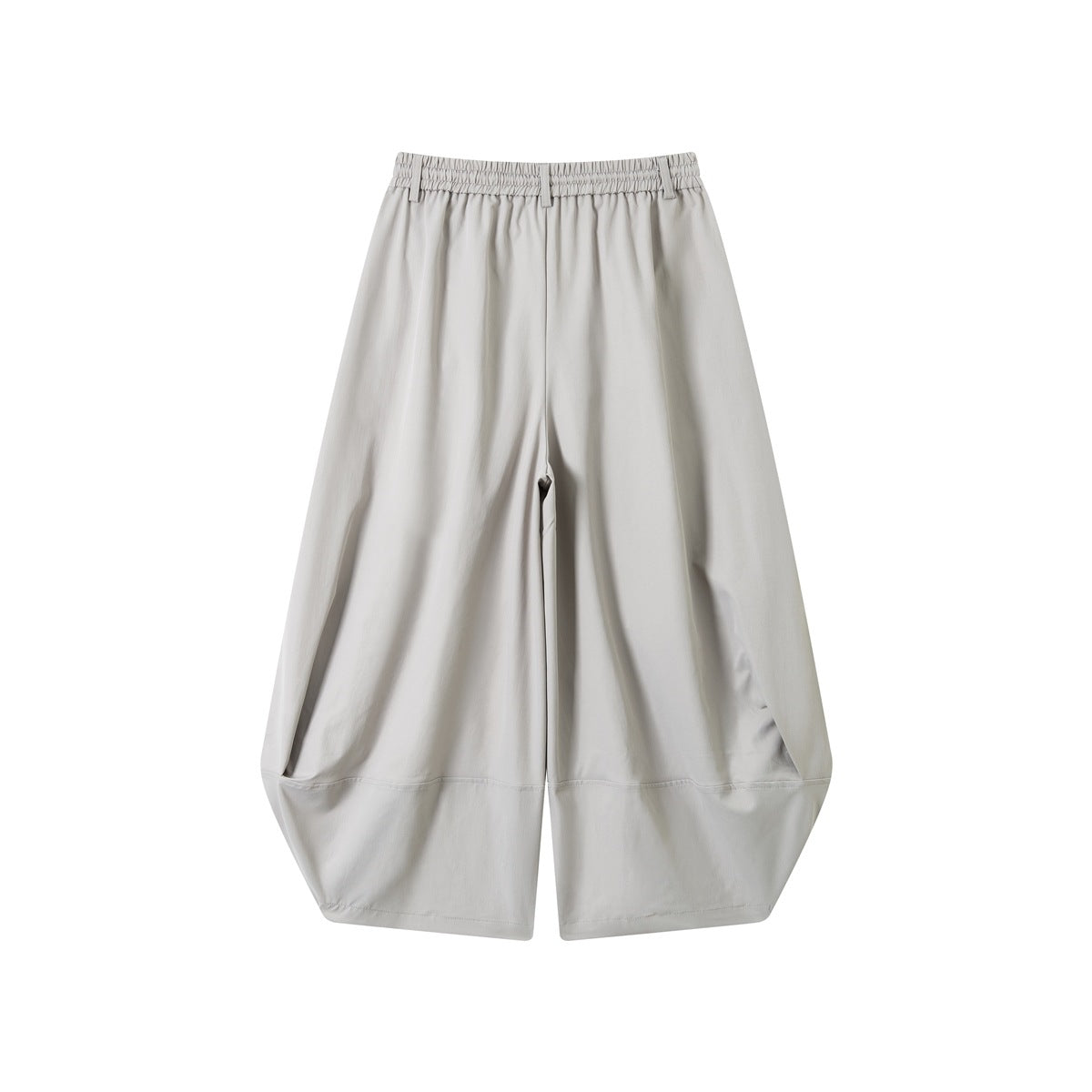 Back view of light gray wide-leg pants with an elasticized waistband and curved panel seams.