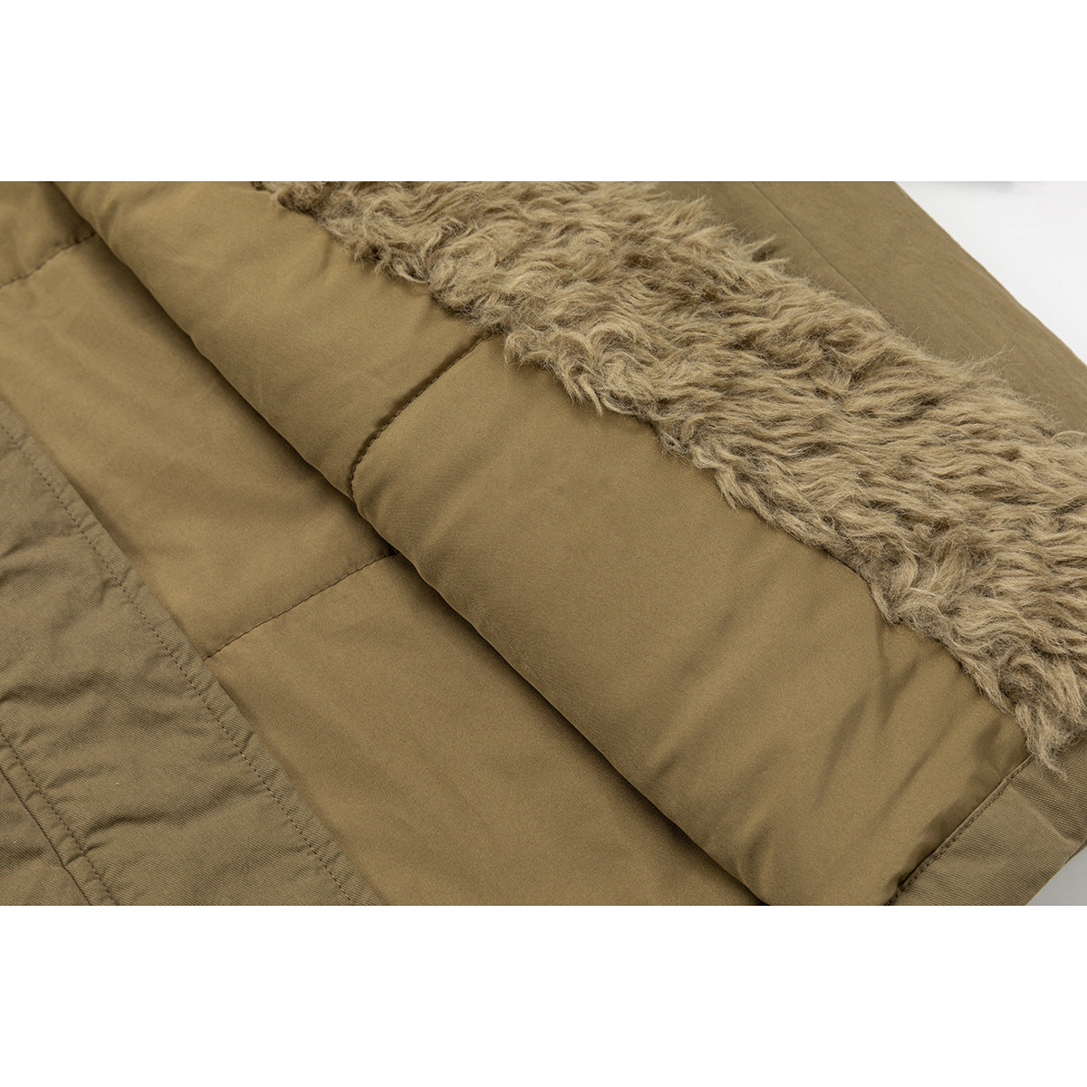 Close-up of the coat's interior, with tan curly lining beside smooth olive-brown panels.