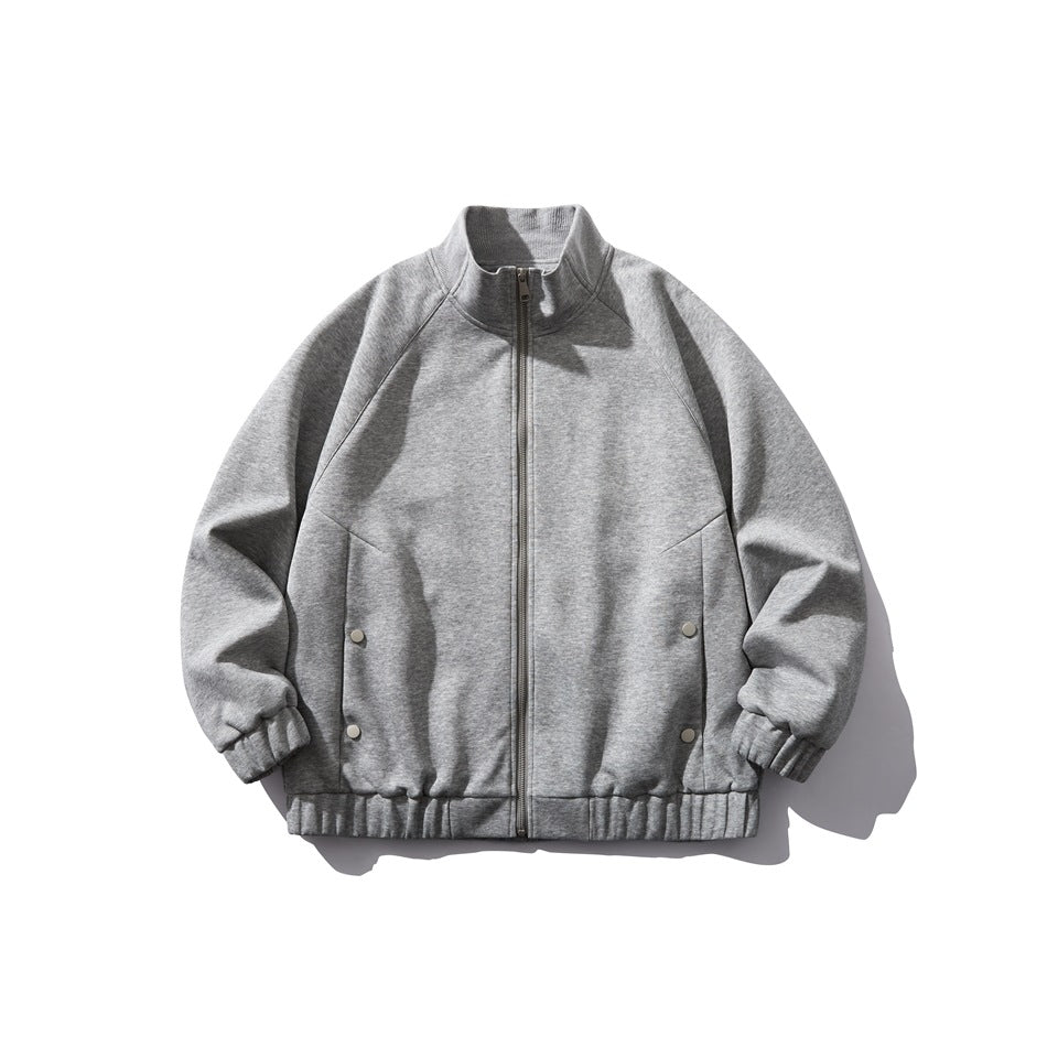 Light gray stand-collar zip jacket flat lay, front view with side snap details and elastic cuffs and hem
