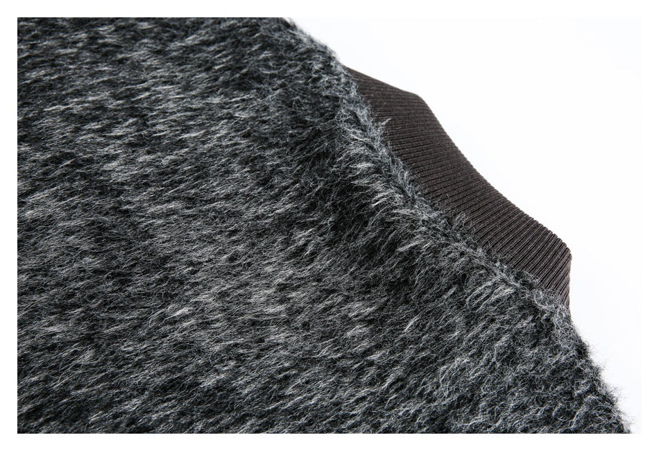 Close-up of fuzzy charcoal garment fabric beside a black ribbed band.