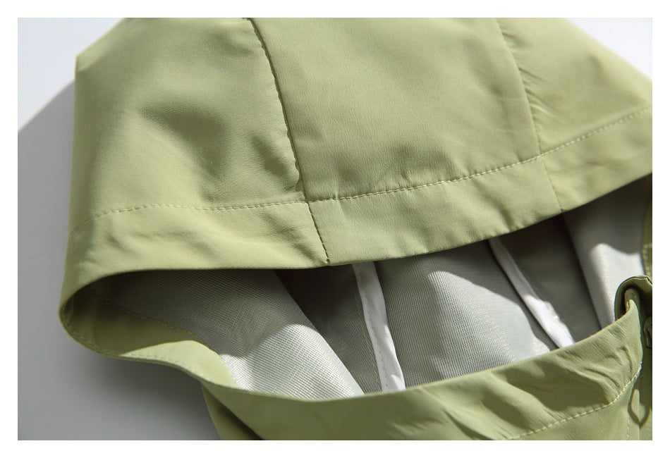 Close-up of the jacket hood's seams and light-colored interior lining.