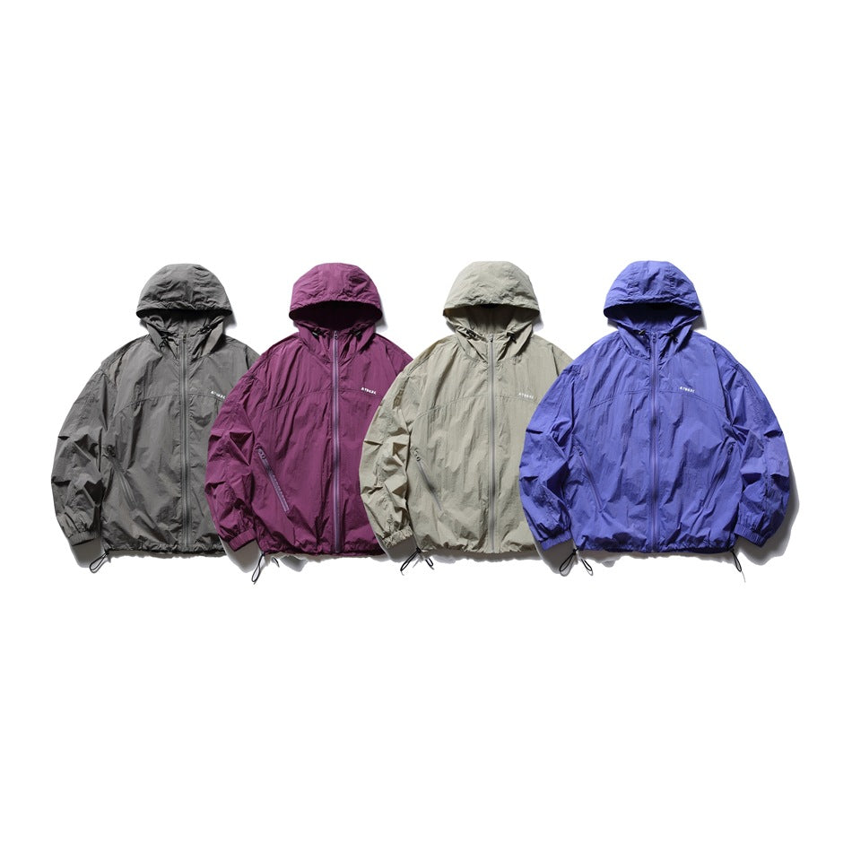 Four hooded zip jackets shown together in charcoal gray, plum, light beige, and blue-violet.