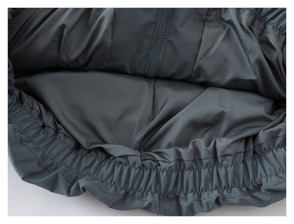 Close-up of the jacket interior, showing the lining, zipper, and gathered elastic hem.