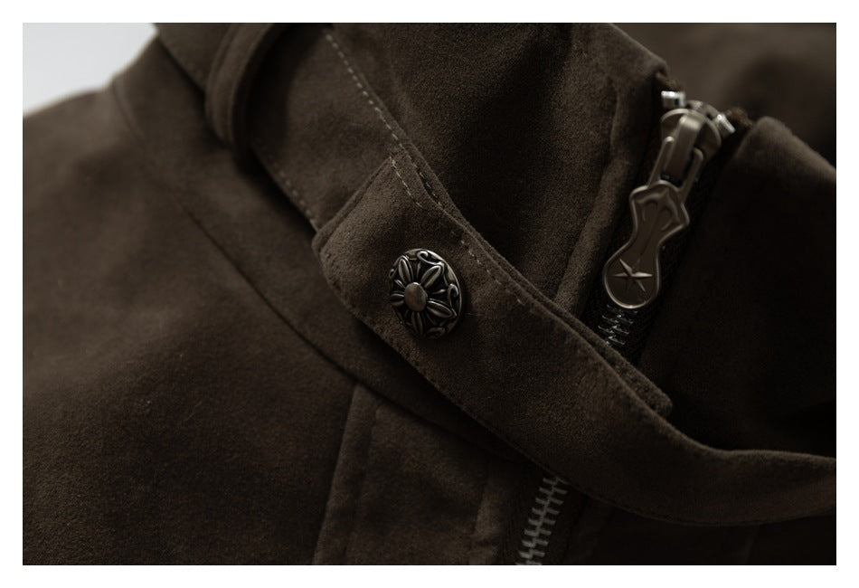 Close-up of the jacket collar strap with decorative metal button and zipper pull.