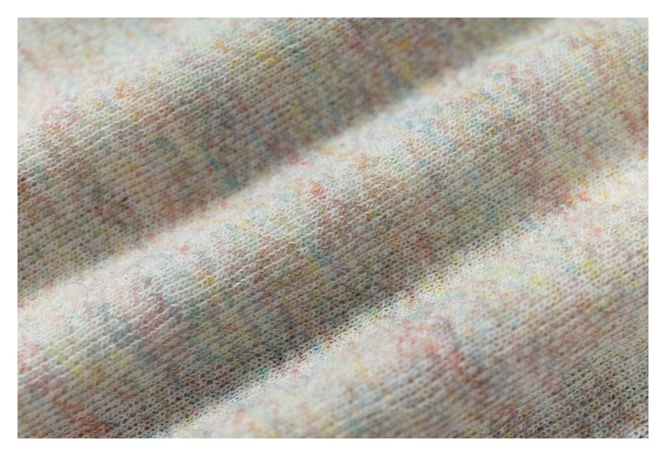 Macro view of the T-shirt’s soft-looking pastel-speckled knit texture.