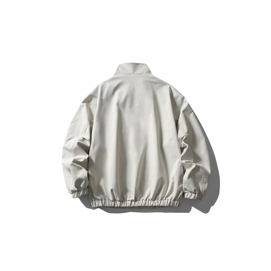 Back view of an off-white zip-up jacket with a stand collar and gathered cuffs and hem.