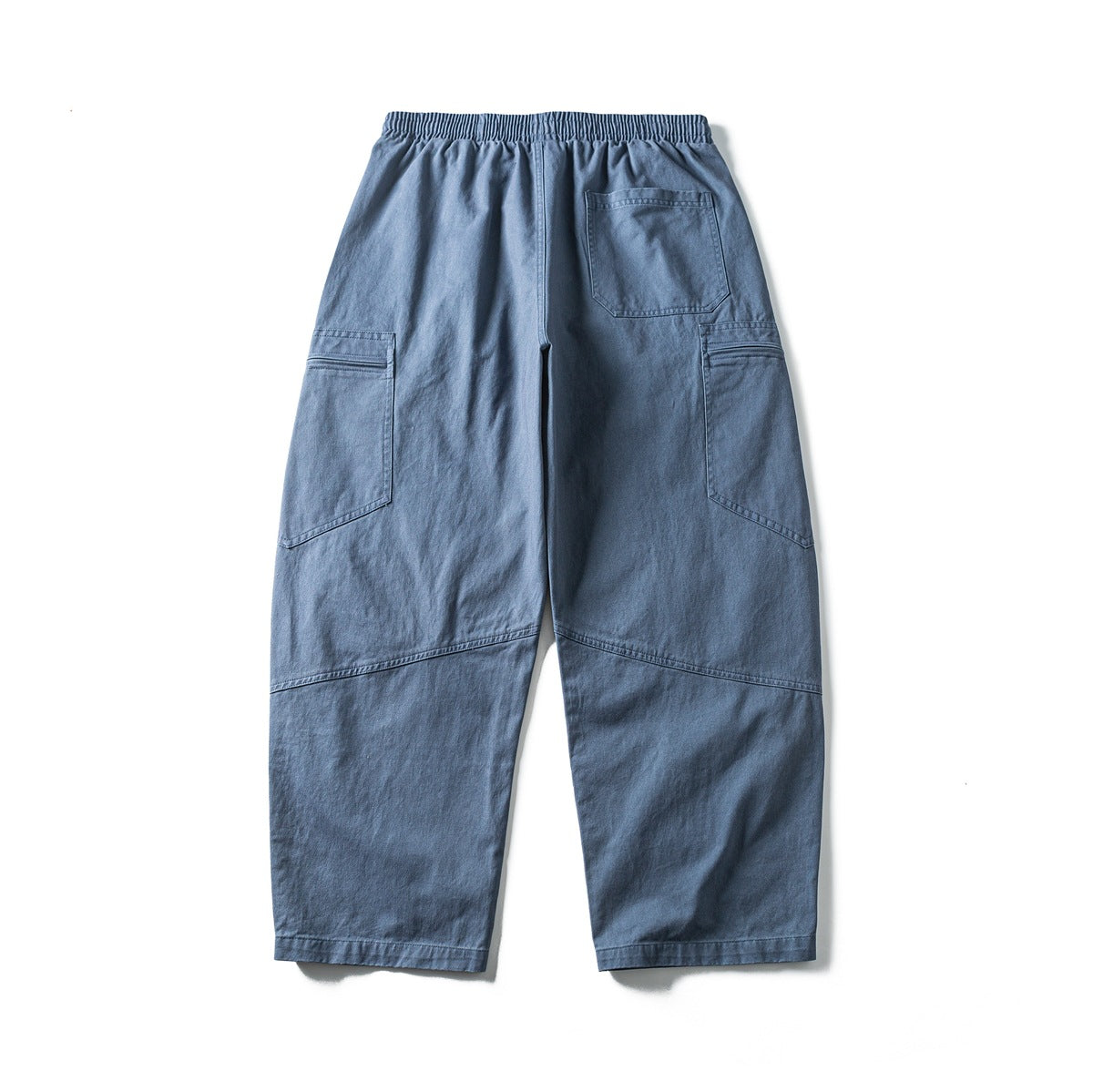 Back view of blue cargo pants with an elastic waist, one rear pocket, and large side pockets.