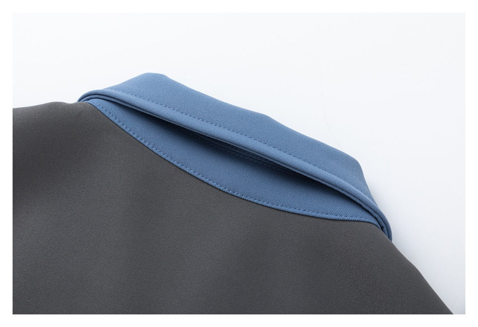 Close-up of the charcoal jacket's back neckline with a blue collar.